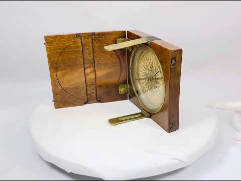 Mid-19th century British alidade compass in walnut case, silvered degree ring, and paper label, crafted by Thomas Jones of Liverpool, 6.1 x 6.1 inches closed, used for surveying and navigation.