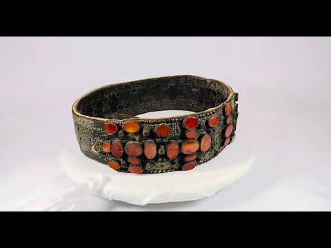 Ornate Southern Russian bridal belt, 17th–18th century, crafted with riveted brass plates and inlaid with vibrant Cornelian stones, used in Jewish wedding ceremonies.