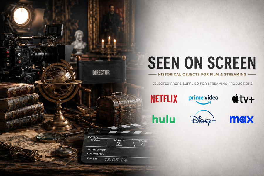 Film set featuring antique books, an armillary sphere, a decorative chest, historical artifacts, and camera equipment, representing props supplied by Relic & Rarity for streaming productions.