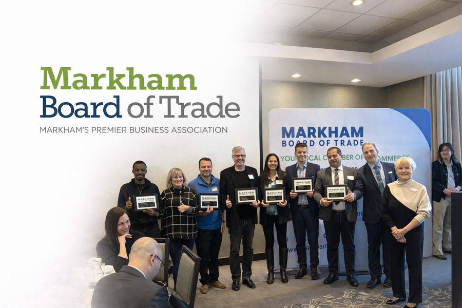 Markham Board of Trade award presentation featuring local business members holding plaques during a chamber of commerce recognition event in Markham, Ontario.