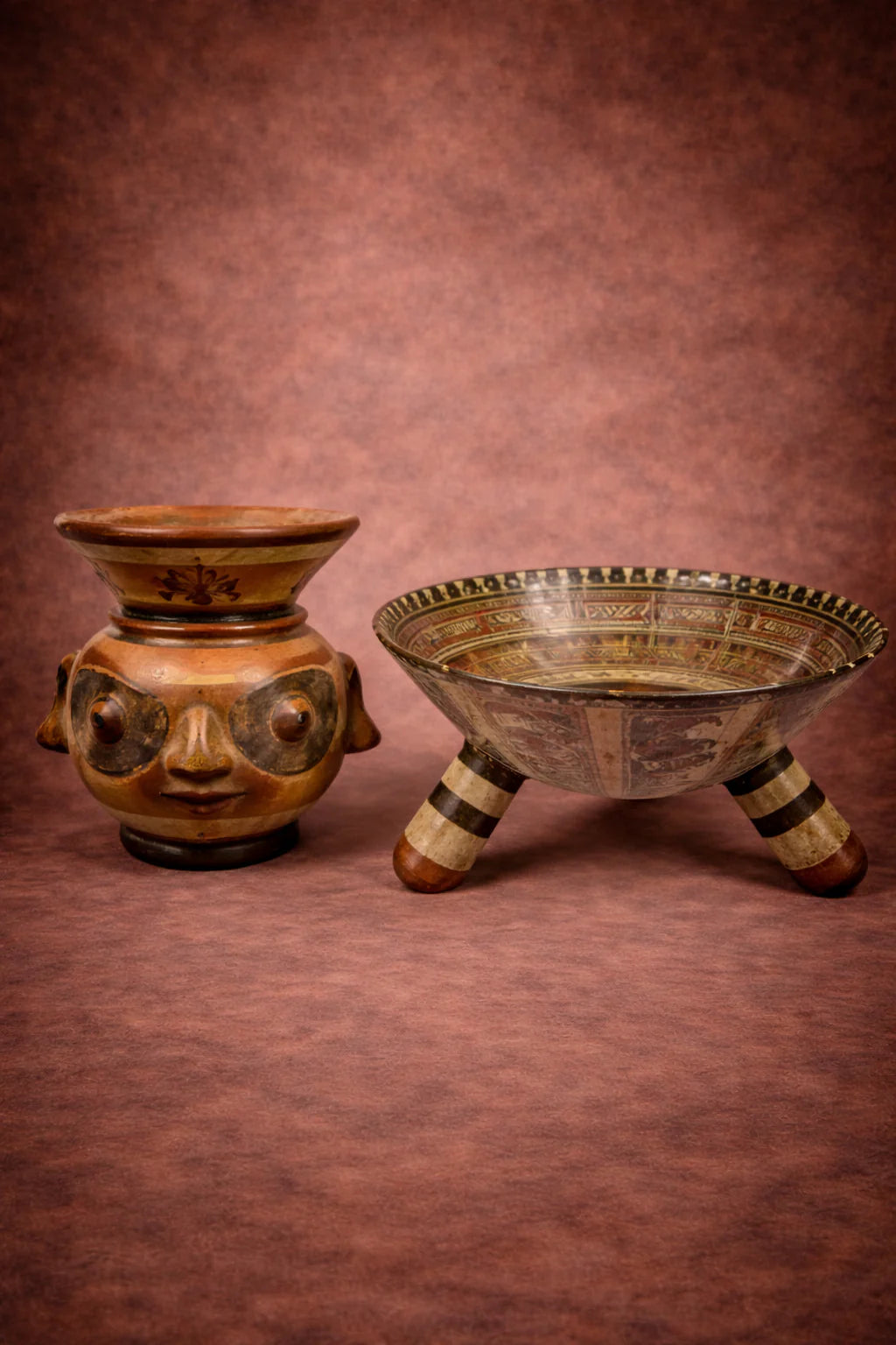 Pre-Columbian ceramic vessels including an effigy face pot and tripod bowl displayed by Relic & Rarity