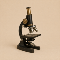 Vintage microscope representing researchers and academic professionals served by Relic & Rarity.