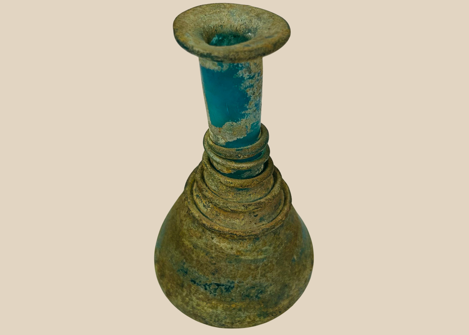 Ancient Roman turquoise glass unguentarium perfume bottle with spiral trailing decoratio