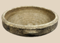 Authentic Roman North African terracotta bowl dating to the Roman Imperial Period, featuring a broad shallow form with traces of white slip.