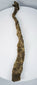 Ancient Egyptian mummified crocodile with frayed linen fibres, overlapping textile bands, and aged surface