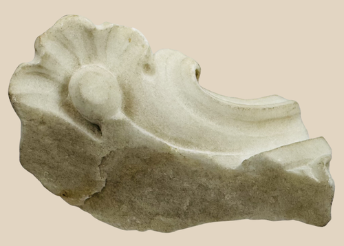 Baroque marble architectural fragment from the Church of San Domenico in Noto, Sicily, featuring carved floral ornamentation.