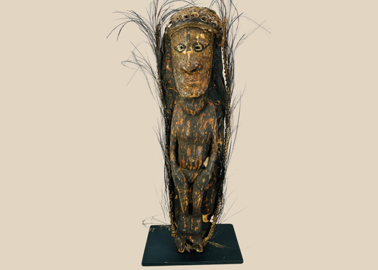 Sepik River Papua New Guinea ancestor figure with shell eyes and feather adornments