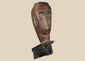 Antique Southeast Asian carved hardwood figure fragment with expressive stylized facial features