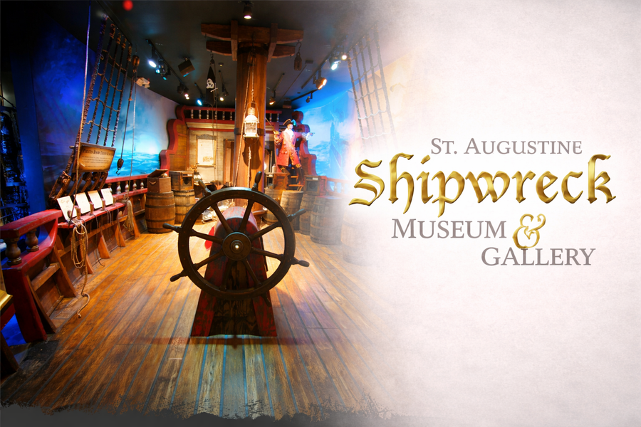 Interior pirate ship exhibit at the St. Augustine Shipwreck Museum & Gallery featuring ship wheel, barrels, ropes, and maritime artifacts.