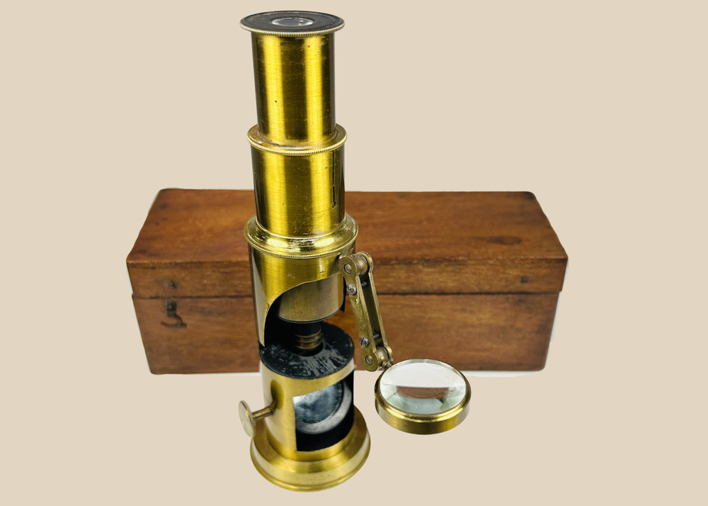 Victorian brass field microscope in original mahogany case with mirror and lens