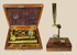 Victorian brass simple microscope with mahogany case and interchangeable lenses